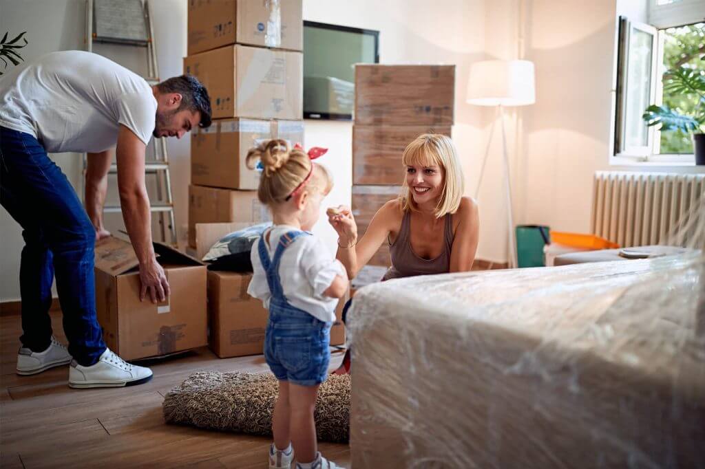 A family packing up boxes
